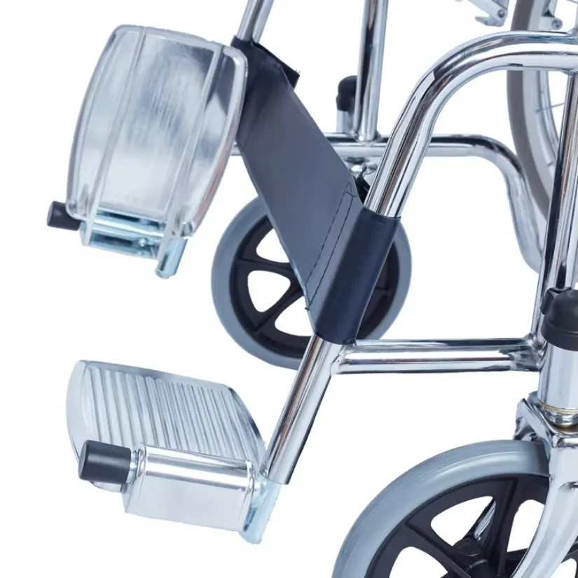 Existing AryMD 809 manual wheelchair photograph showing footplate and front caster close-up