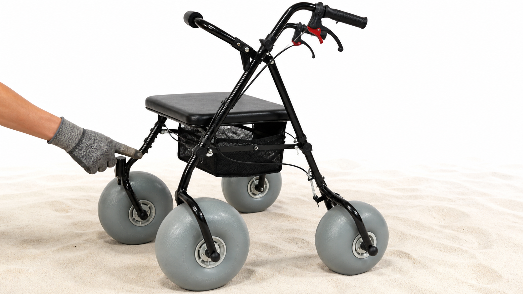 Close product-faithful view of beach walker wheels, brake controls, frame joints, and seat during inspection
